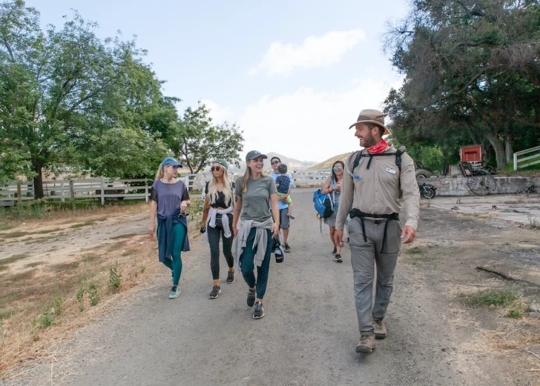 guide talking to guests on malibu wine hike