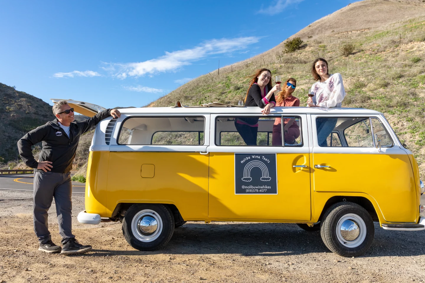 guests sippin wine on vw bus tour