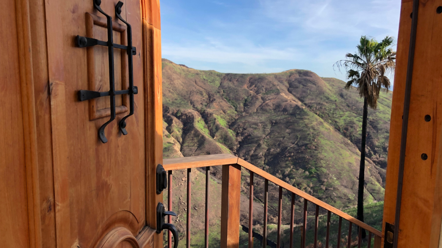 malibu home door open overlooking santa monica mountains