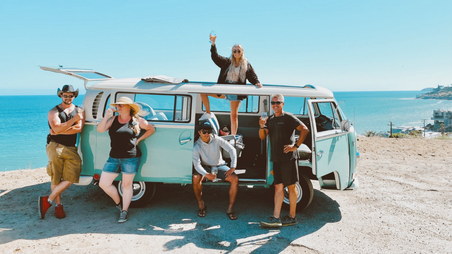 group of people on a vw bus wine tour in malibu