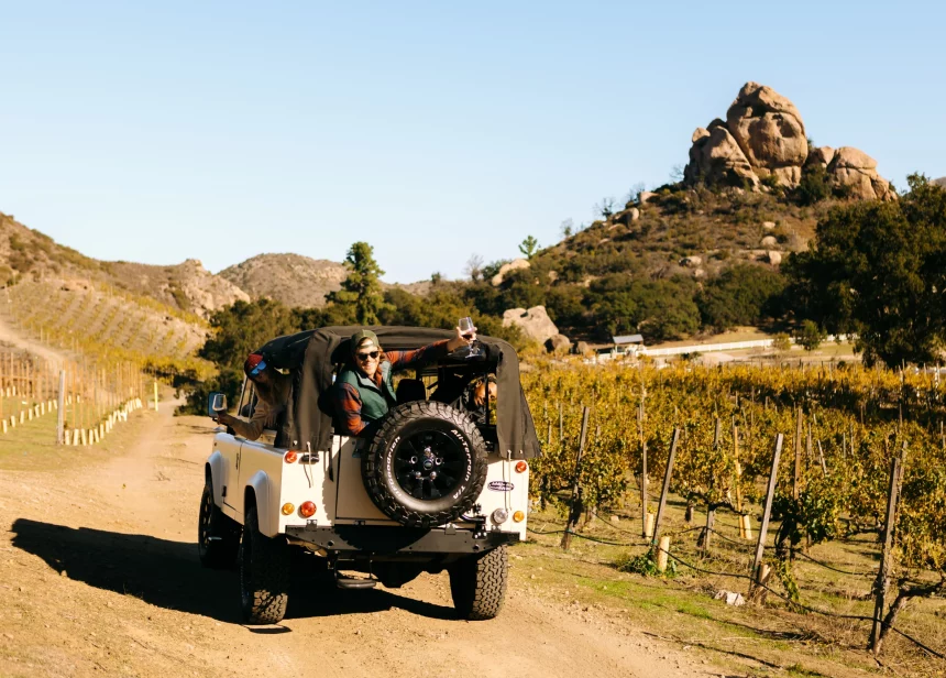 group in 4x4 vehicle on wine tour