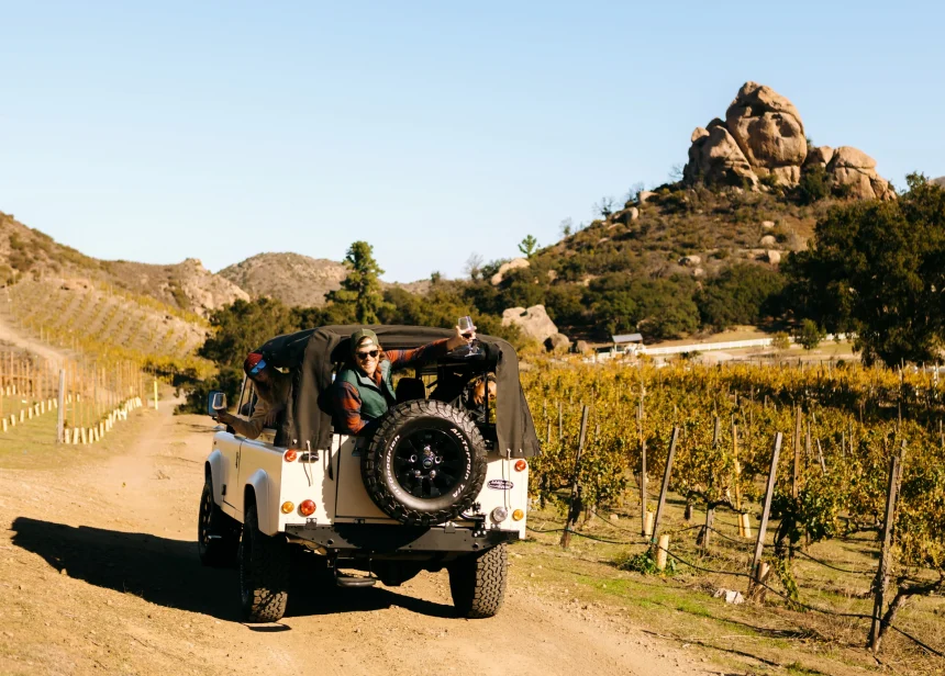 group in 4x4 vehicle on wine tour